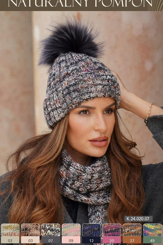 Kamea luxurious Pavone hat featuring a stylish pom-pom and elegant cuff, showcasing unique design and colourful texture for a chic winter look.