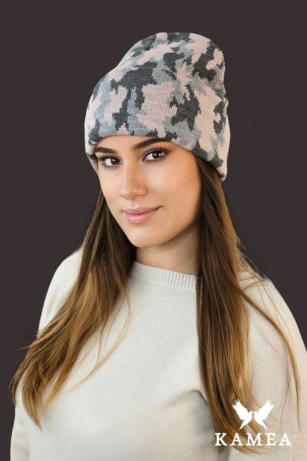 Kamea Ventura Beanie displayed outdoors, highlighting its warm khaki tones and trendy camouflage style for winter fashion.