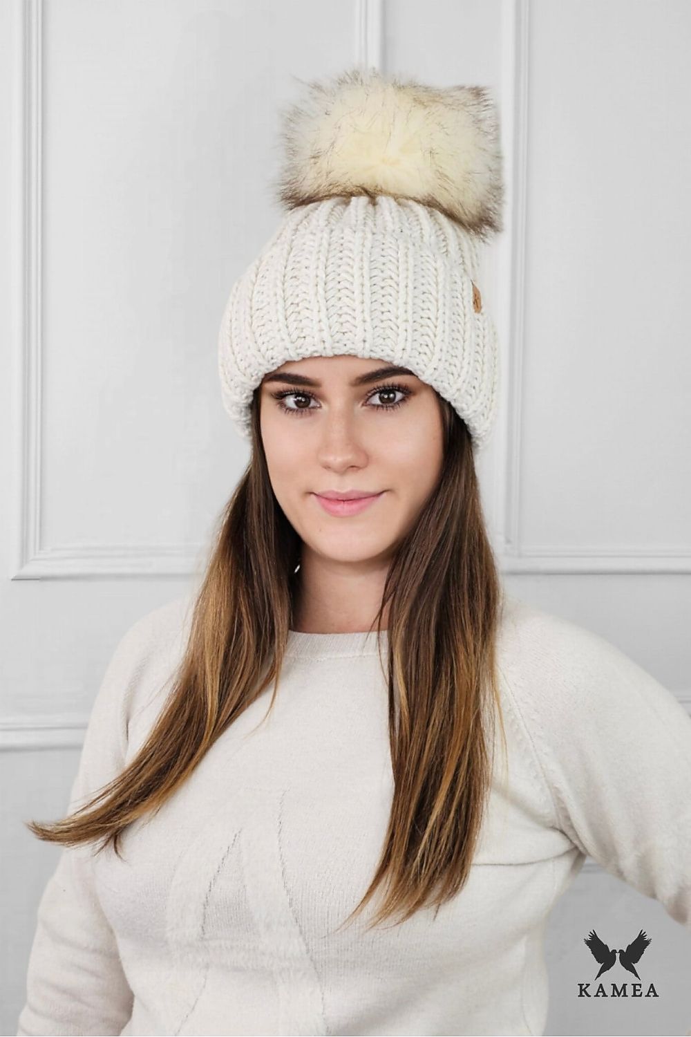 Kamea Nerea mustard winter hat featuring eco-friendly pompom, thick knit design, and fleece lining for ultimate comfort in luxury.