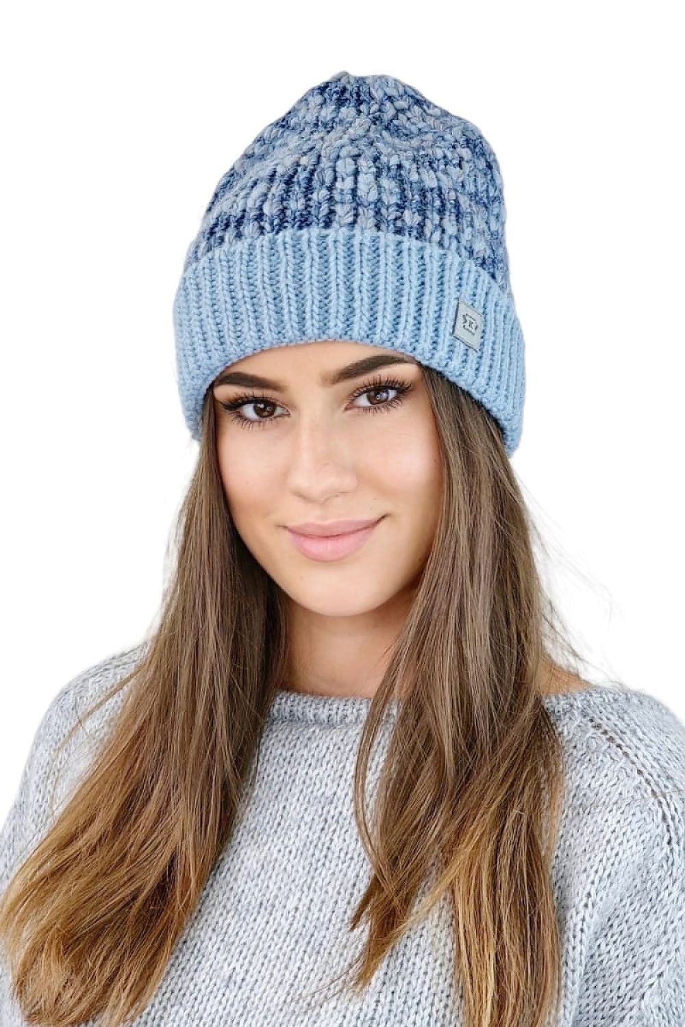 Model wearing the chic Kamea navy blue beanie, exemplifying warmth and comfort in a fashionable youth accessory.
