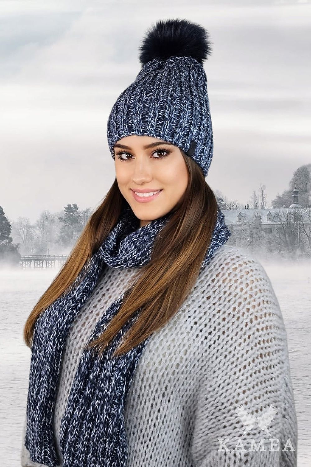 Luxury WEZYR Winter Hat by Kamea featuring a faux fur pompom in navy blue, made from a warm wool blend, ideal for winter style and comfort.