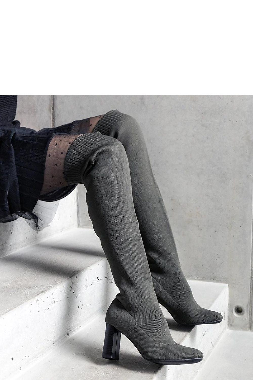 Stylish green stiletto heel boots for women from Solea, featuring an elastic upper and classic almond toe for a sophisticated look.