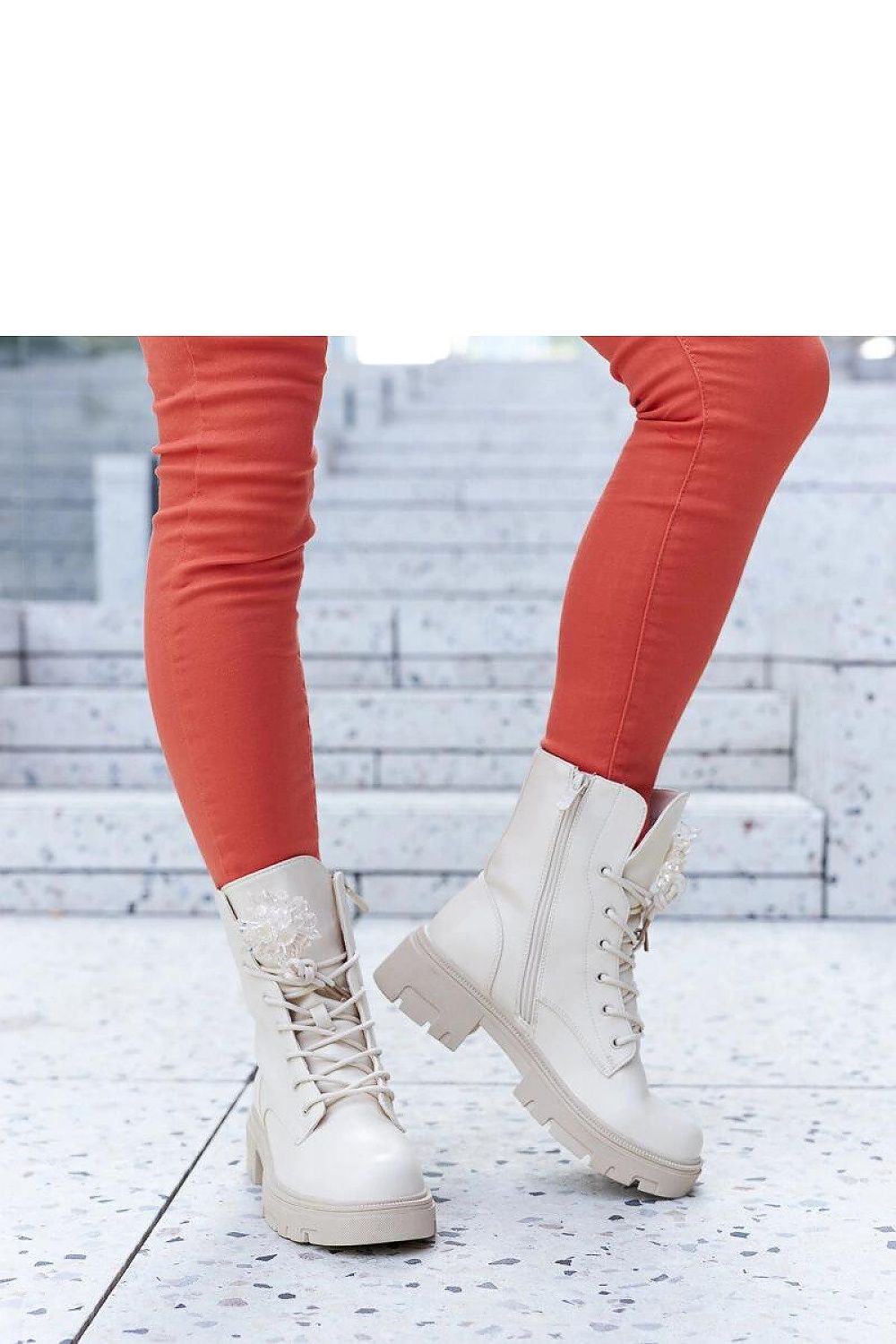 Close-up view of Accadia beige lace-up boots with stylish decorative beads, perfect winter footwear by Solea.