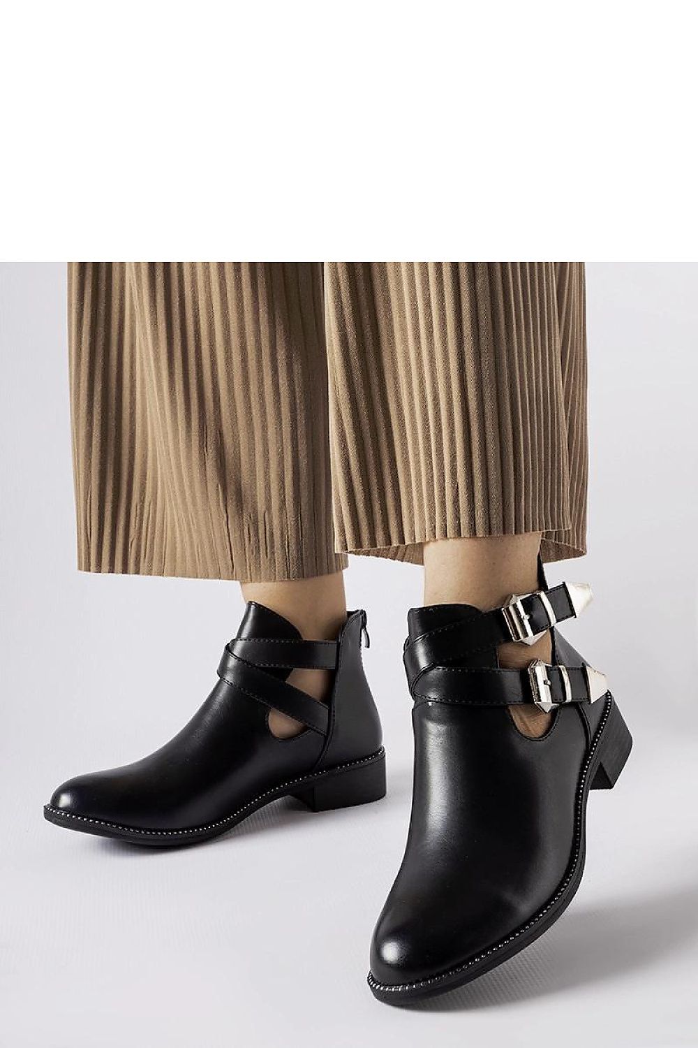 Elegant Solea Black Cut-Out Boots featuring Franca Buckles, crafted from eco-friendly leather, ideal for the fashion-forward individual.