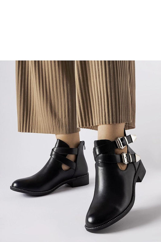 Elegant Solea Black Cut-Out Boots featuring Franca Buckles, crafted from eco-friendly leather, ideal for the fashion-forward individual.