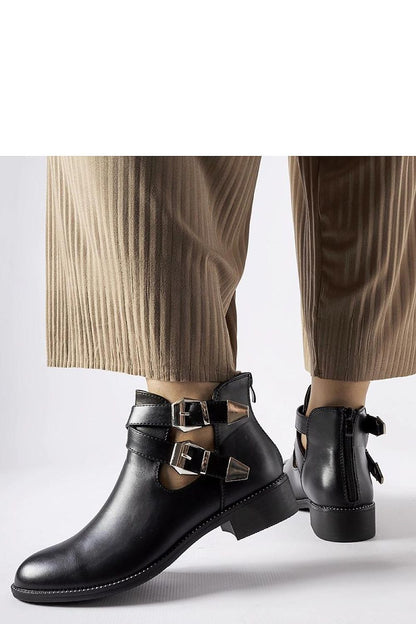 Stylish Solea Black Cut-Out Boots showcasing a unique design with Franca Buckles, perfect for adding sophistication to any outfit.