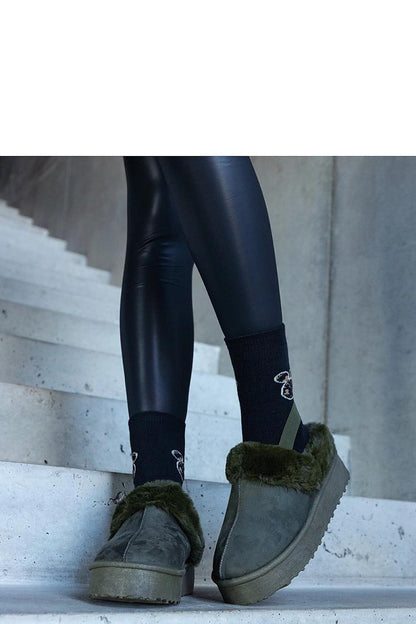 Solea winter platform slippers showcasing a high-quality rubber sole, ensuring stability and fashionable comfort for chic winter outings.