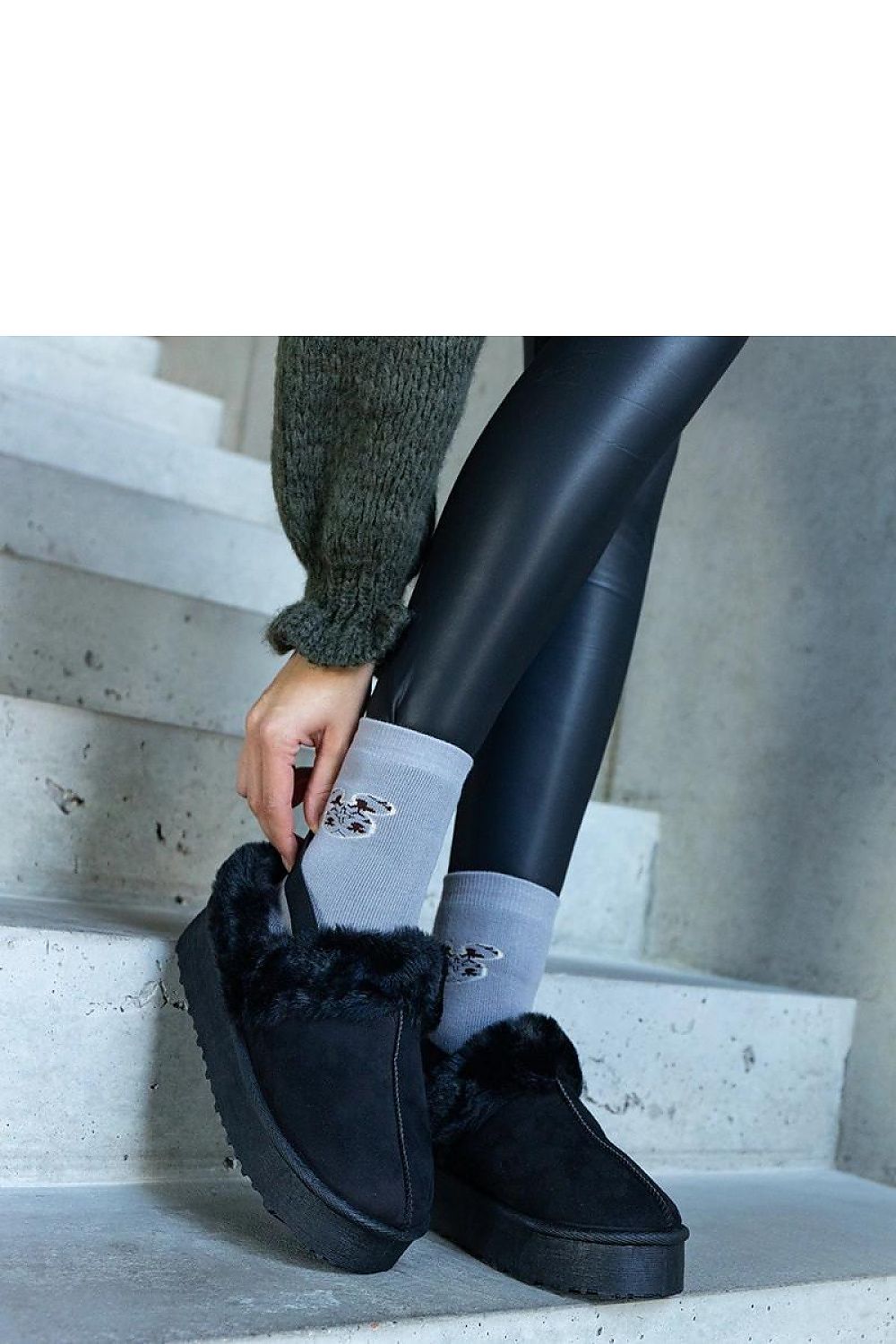 Solea's unique green platform slippers with fur accents, an essential addition to winter luxury footwear collections.