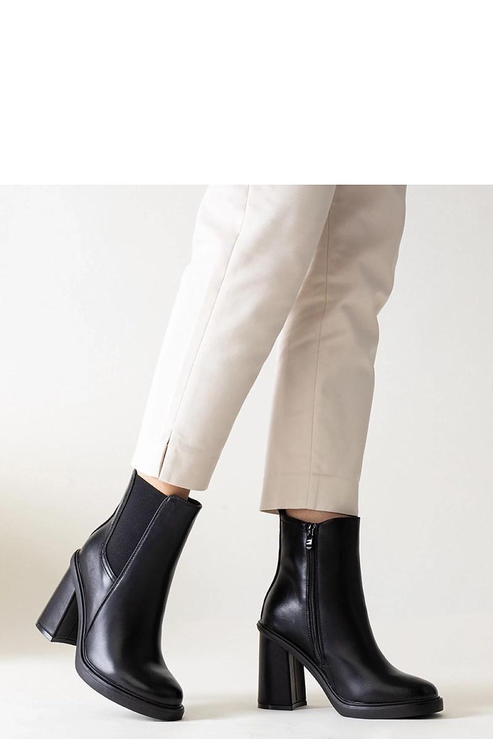 Chic Almase black eco leather stiletto heel boots by Solea, showcasing modern design with a timeless elegance, ideal for versatile styling.