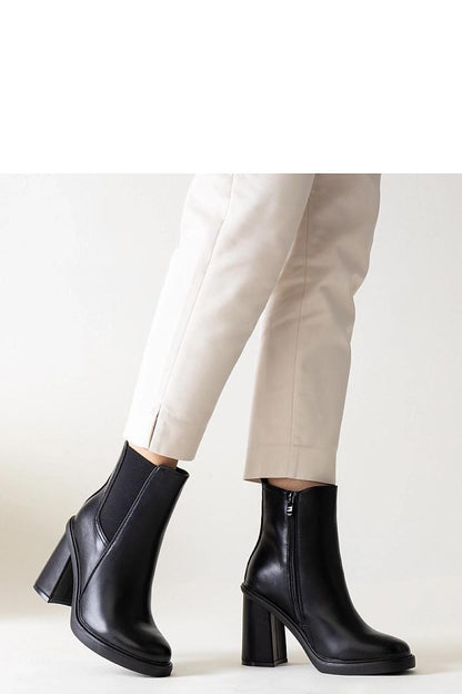 Chic Almase black eco leather stiletto heel boots by Solea, showcasing modern design with a timeless elegance, ideal for versatile styling.