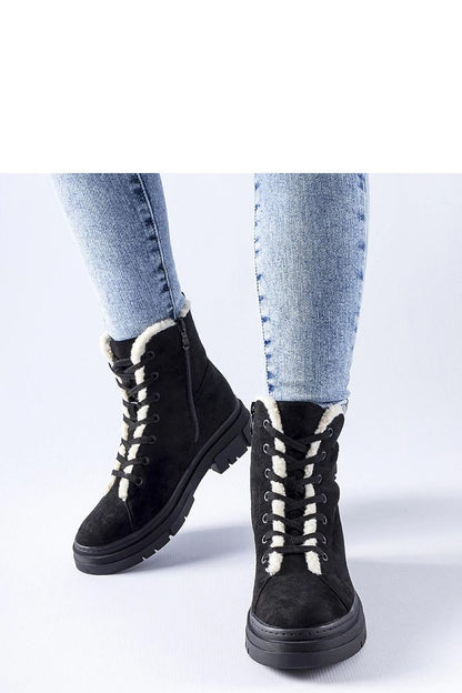 Solea Pompei Black Eco-Suede Insulated Boots displayed on a textured surface, highlighting their fashionable design and practical insulation.