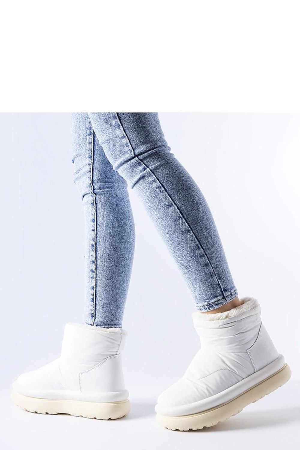 Solea White Insulated Snow Boots displayed against a winter backdrop, illustrating their insulated interior and high uppers for maximum warmth and snow protection in elegant style.