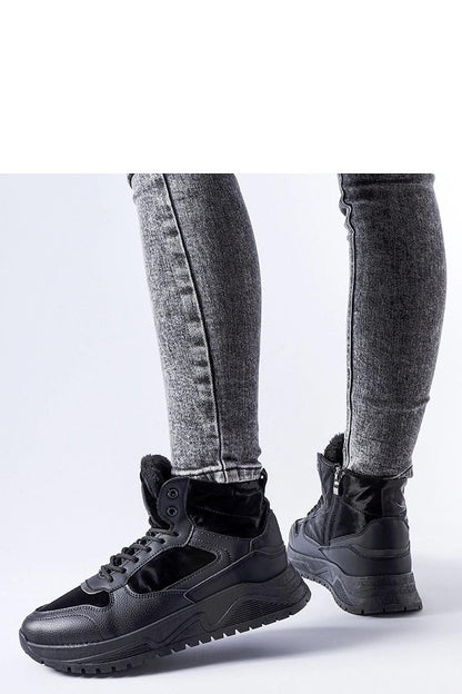 Close-up of Solea black insulated high-top Malles sneakers highlighting the quality rubber material and intricate detailing.