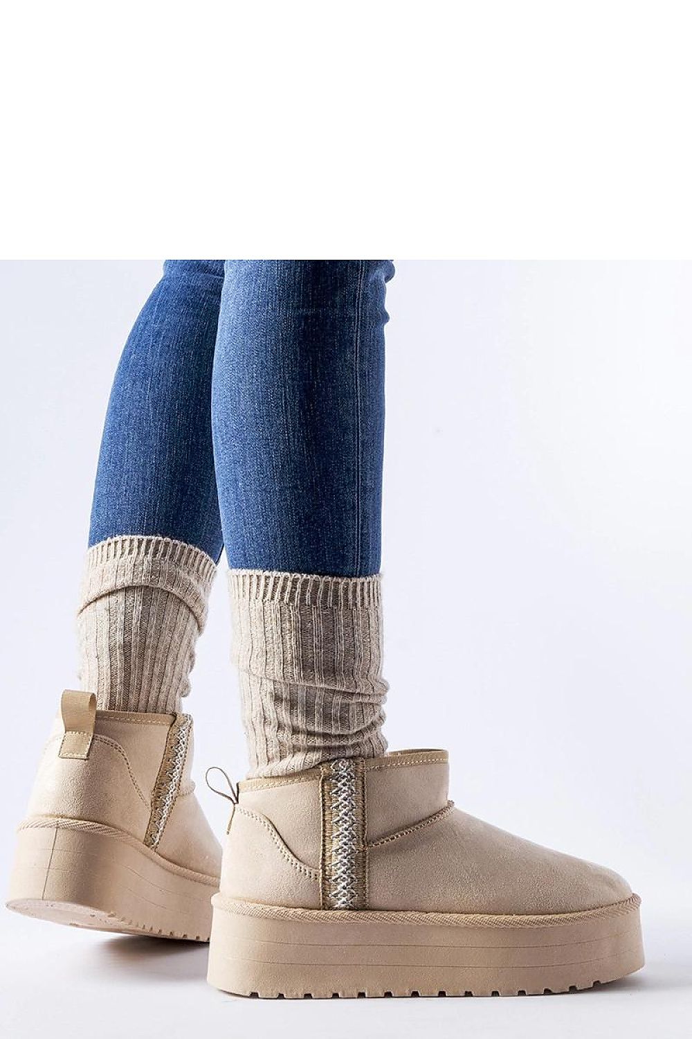Stylish Solea Beige Dennison Platform Snow Boots with a medium heel and slip-on design, ideal for both casual outings and ski trips during fall and winter.