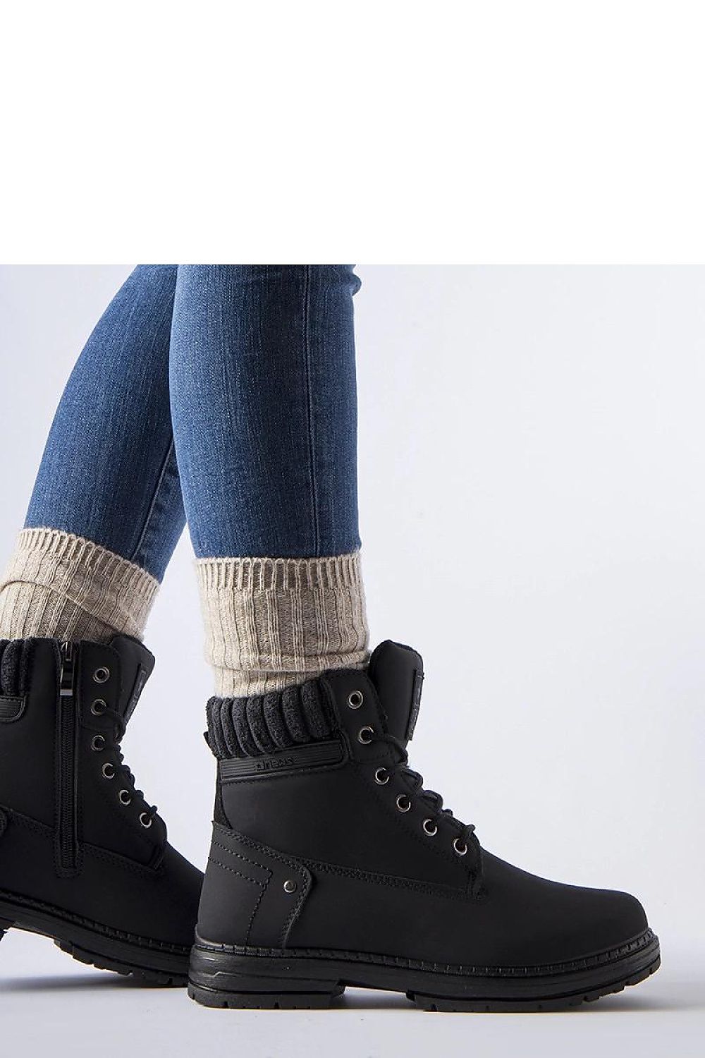 Elegant Solea Araujo women’s black insulated trapper boots styled with winter attire, combining luxury and practicality for chic cold-weather looks.