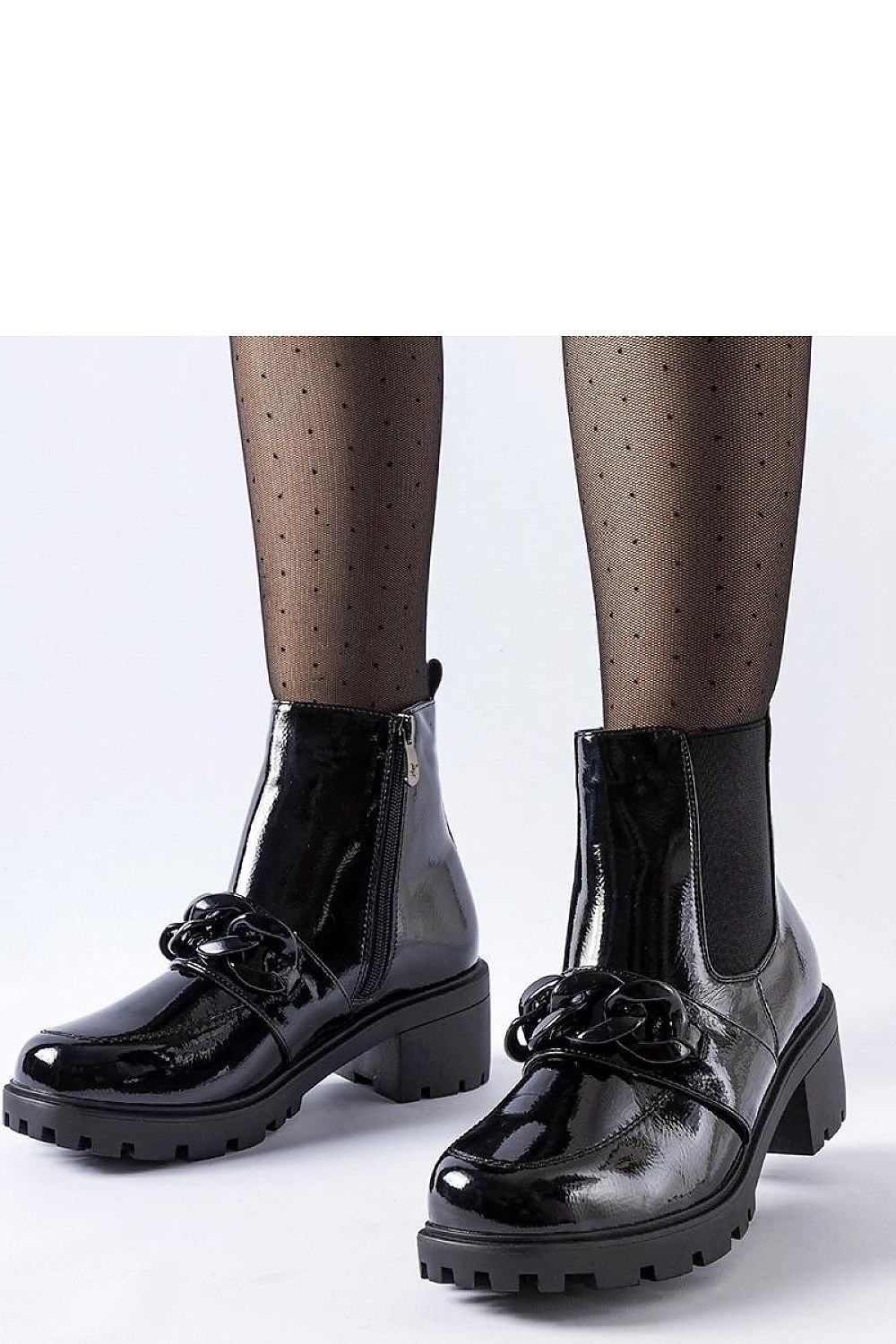 Solea elegant black patent leather ankle boots with a stylish metal buckle, showcasing luxury footwear design.