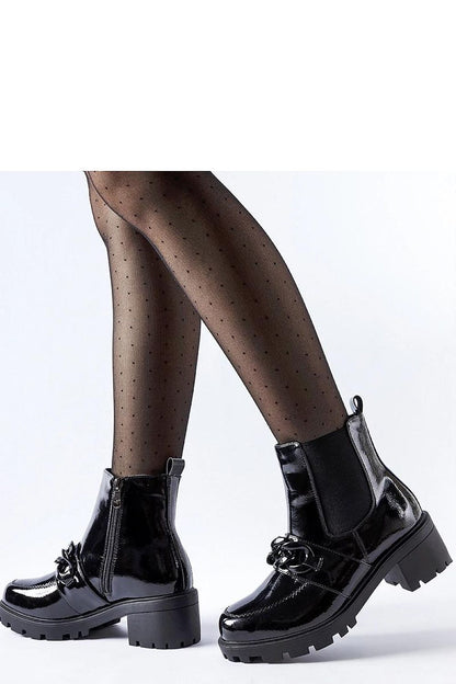 Solea black ankle boots with a robust rubber sole, demonstrating superior traction and elegant style for colder seasons.