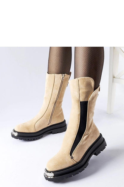 Solea beige insulated Bologna boots featuring a decorative nose and medium heel, crafted for warmth and sophistication during colder seasons.