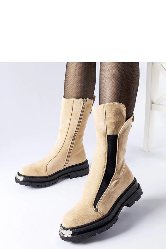 Solea beige insulated Bologna boots featuring a decorative nose and medium heel, crafted for warmth and sophistication during colder seasons.