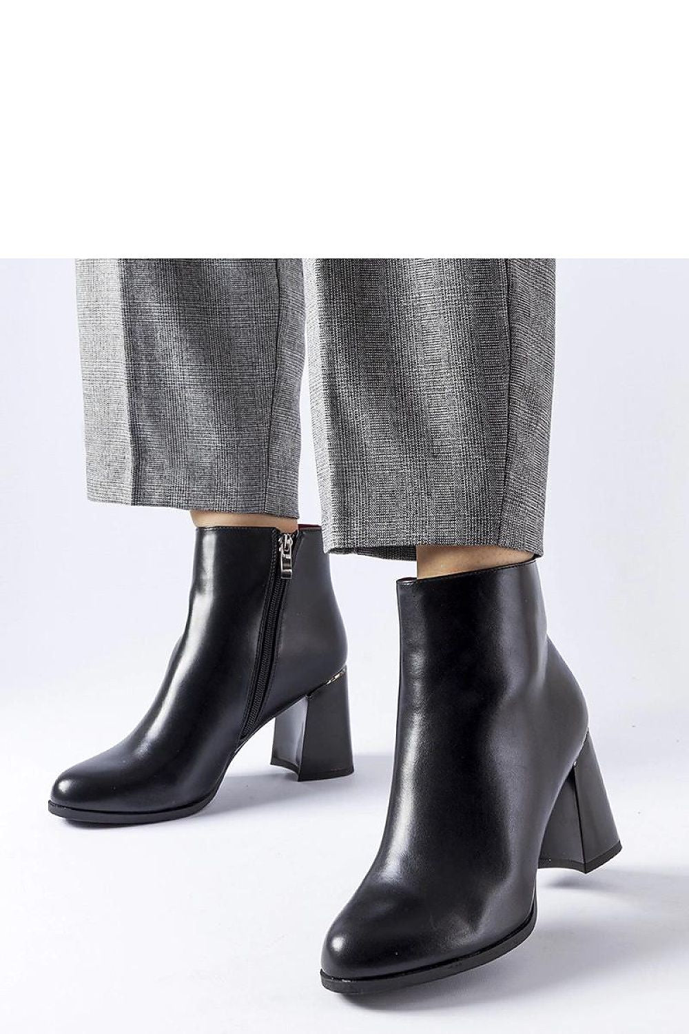 Luxurious black eco leather heel boots by Solea featuring a decorative Clivi heel, perfect for winter elegance and comfort.