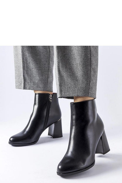 Luxurious black eco leather heel boots by Solea featuring a decorative Clivi heel, perfect for winter elegance and comfort.