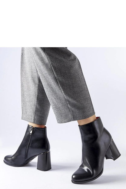 Elegant black eco leather heel boots by Solea with decorative Clivi heel, featuring almond toe and stylish stiletto, ideal for winter fashion.