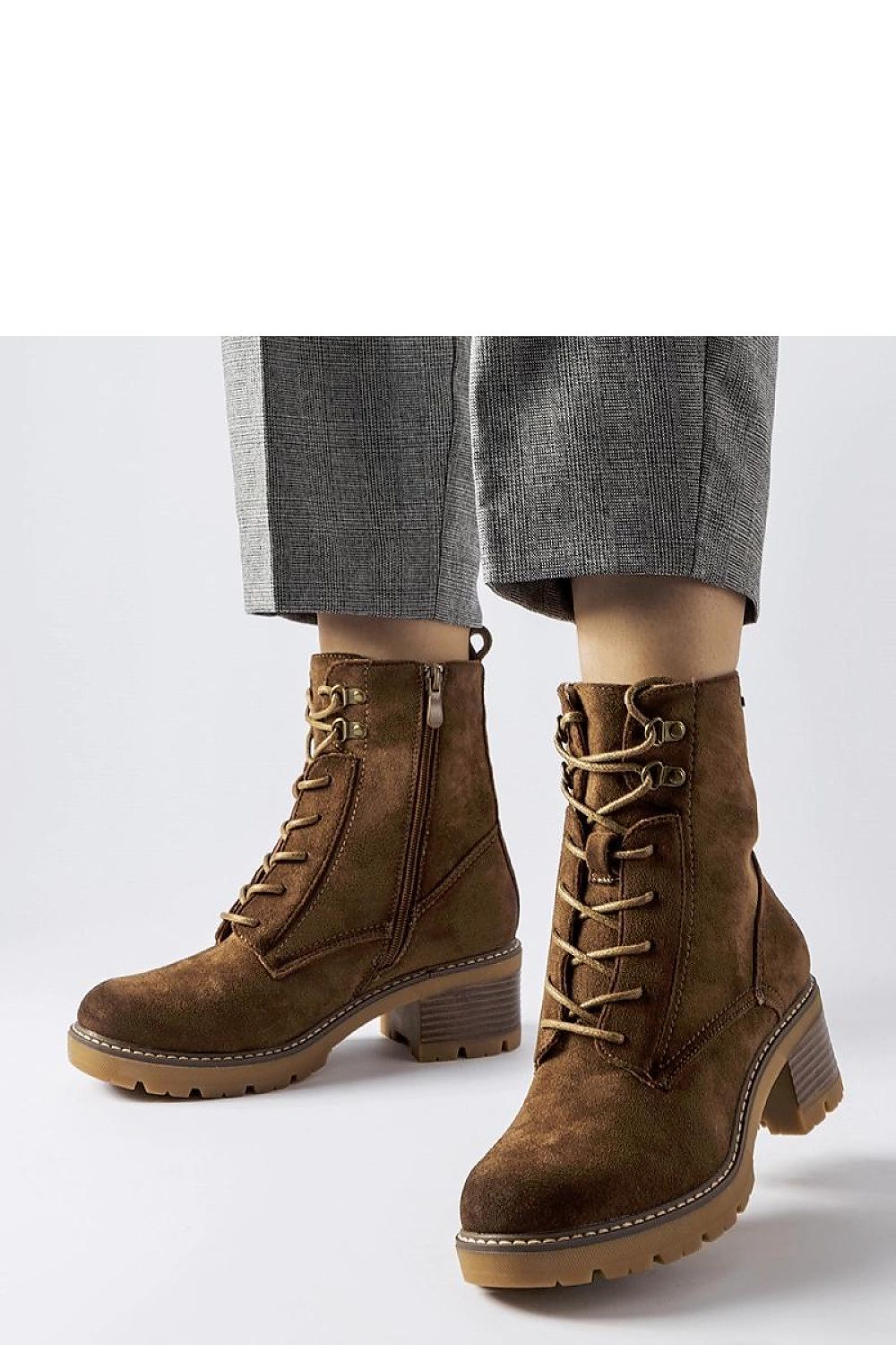 Side perspective of Solea Clementina black block heel boots, highlighting the zipper closure and ankle-length design perfect for sophisticated winter fashion.