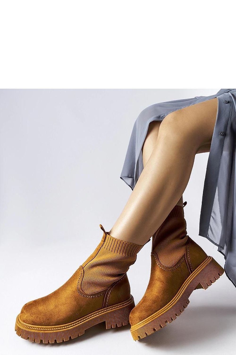 Elegant Solea brown eco-suede boots, designed with meticulous stitching and a slip-resistant rubber sole.