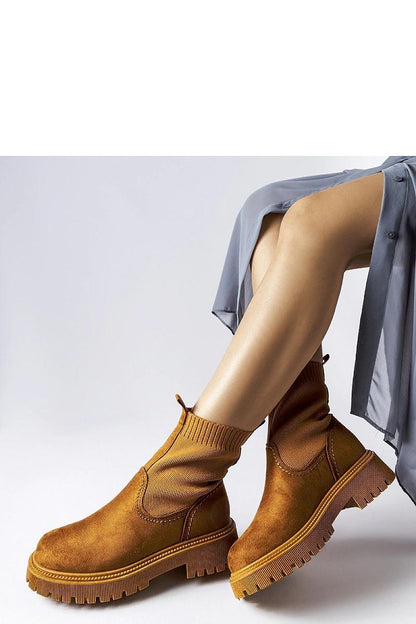 Elegant Solea brown eco-suede boots, designed with meticulous stitching and a slip-resistant rubber sole.