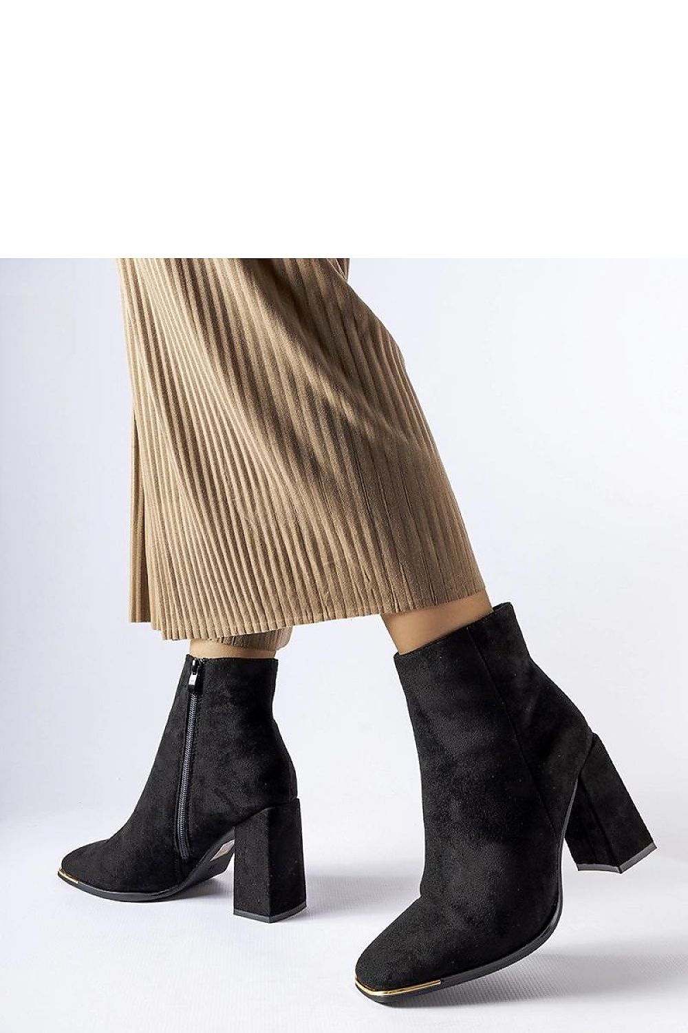 Solea Black Cheney stiletto boots styled with fashionable attire, highlighting their versatility for both casual and formal outfits.