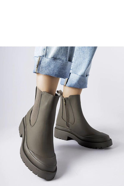 Elegantly designed Solea green women's boots made of durable rubber, featuring zip closure and a stylish medium heel, perfect for autumn-winter fashion.