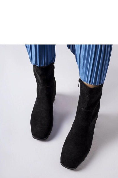 Stylish black eco leather heel boots by Solea with a comfortable zip design, showcasing luxury and comfort.