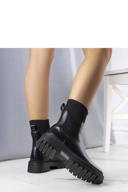 Luxury Caland Black Eco-Leather Boots by Solea, featuring insulated comfort for winter with stylish high sole and warm simulated fur lining.