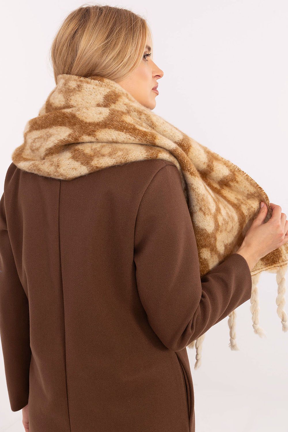 Elegant lifestyle image of the 214 cm polyester shawl scarf by AT, draped gracefully over an outfit, emphasising its warmth and sophisticated style.