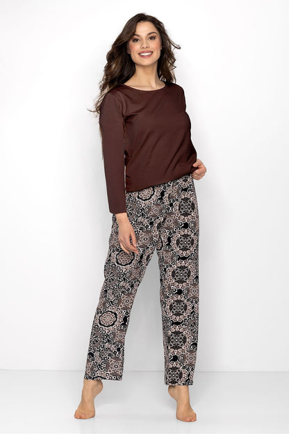 Elegant women's pyjamas set by Momenti Per Me featuring a comfortable long-sleeved blouse and relaxed trousers, designed for style and comfort.