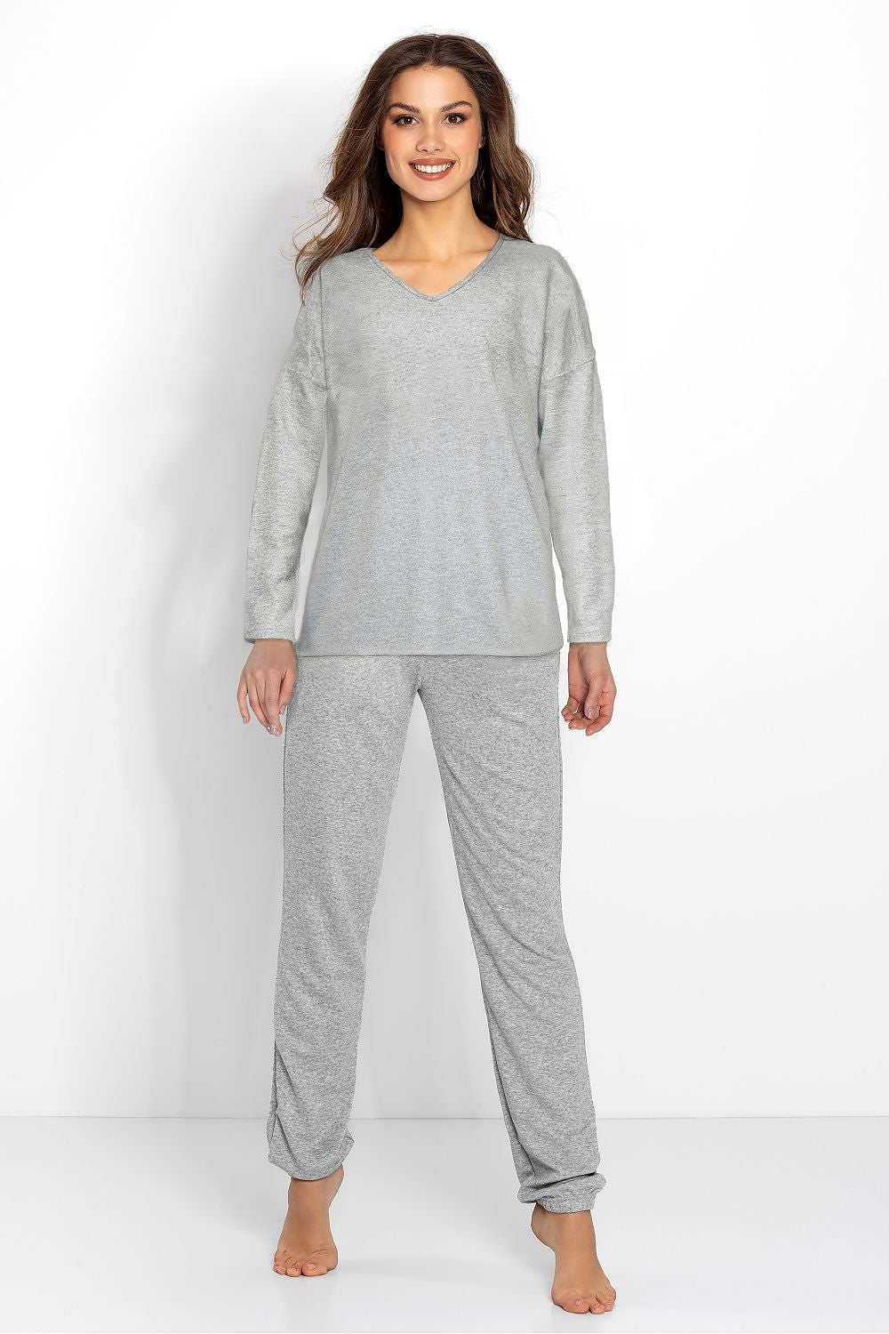Elegant women's pajamas set by Momenti Per Me, featuring a long sleeve lace blouse and cuffed pants in sizes S-XL, perfect for luxurious comfort and chic homewear.