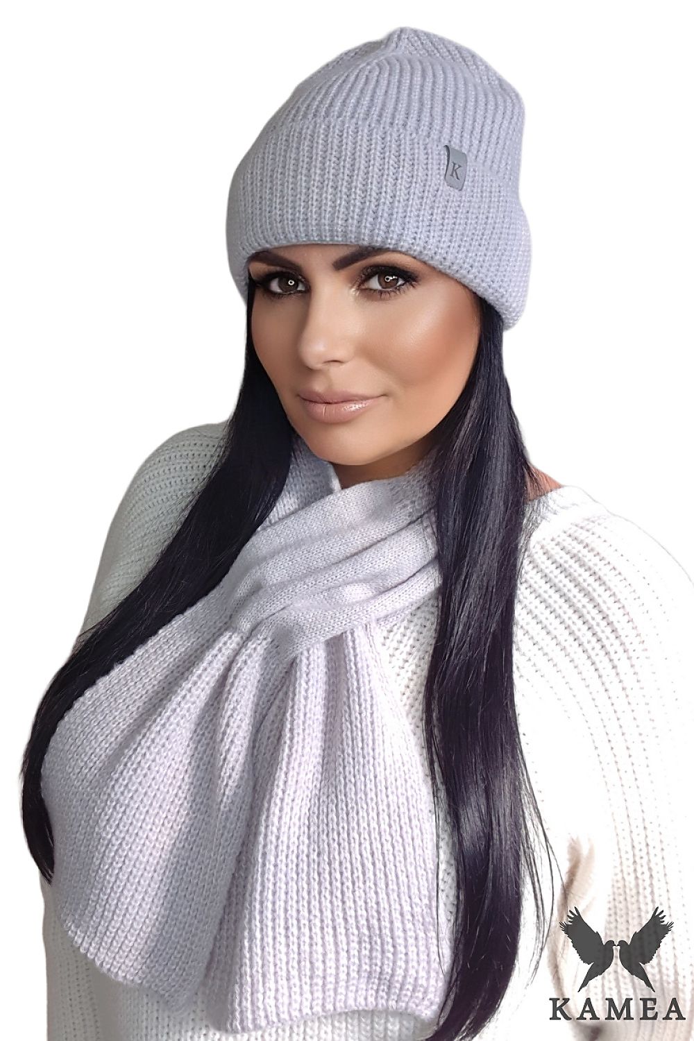 Model wearing Kamea Chloe Hat & Scarf Set in light heather, blending warmth and style for an elegant winter look.