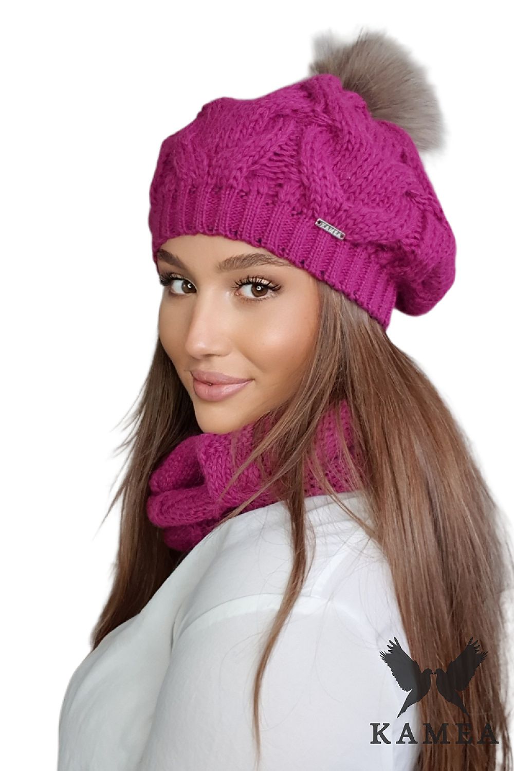 Luxurious fuchsia women's beret and neck warmer set by Kamea, featuring a stylish fur pom pom and high-quality wool yarn for ultimate warmth and comfort during autumn-winter season.