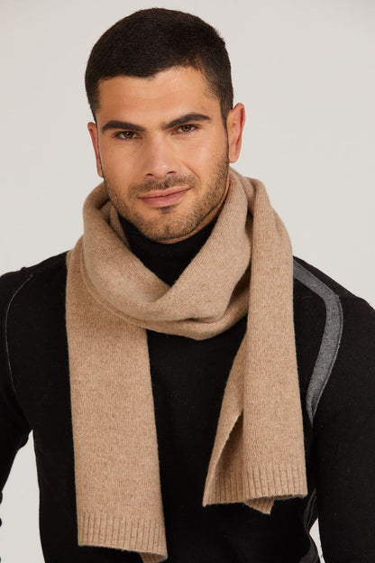 Luxurious camel wool scarf by Kamea, showcasing its soft texture and elegant design for winter warmth.