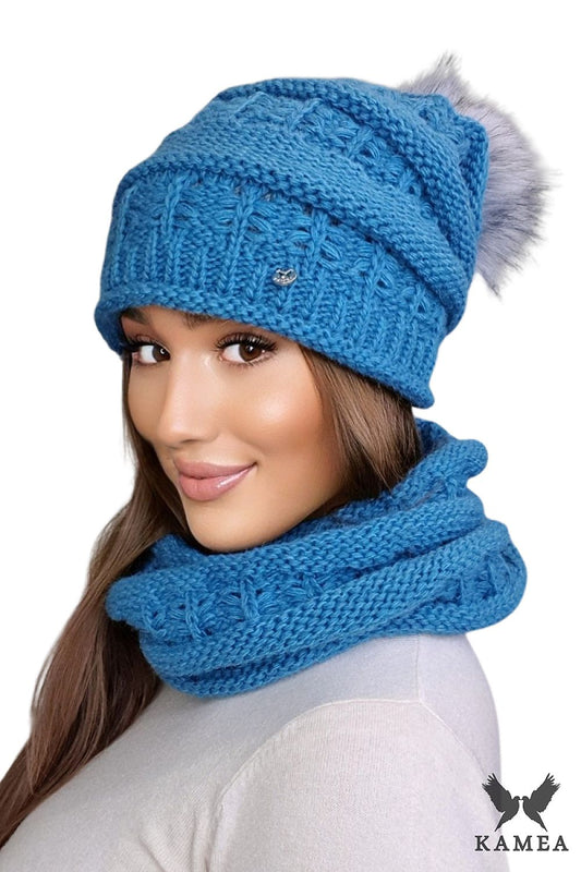 Premium women's winter set in turquoise by Kamea featuring a luxurious fluffy pompom hat and unique woven design, perfect for elegance and warmth.