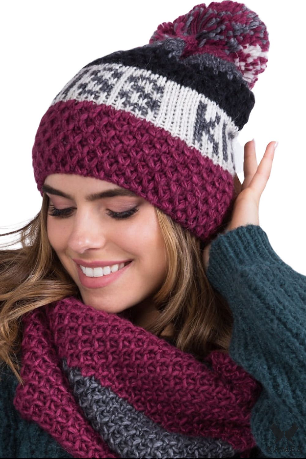 Luxury fuchsia women's hat by Kamea featuring a knitted pompom, crafted from soft yarn with unique patterns for warmth and style.