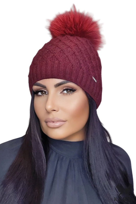 Premium burgundy mohair wool pom-pom hat for women by Kamea from the Shakti Noble Beauty collection, showcasing its unique character and luxurious texture.