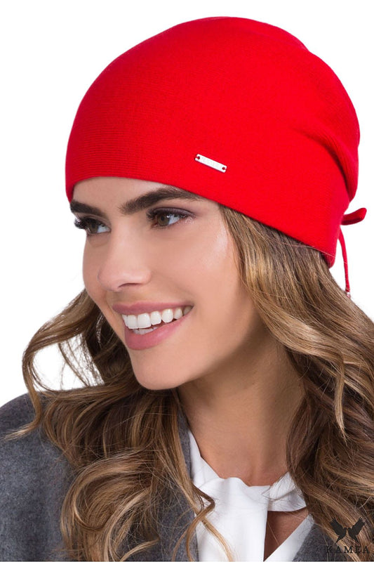 Premium coral women's hat by Kamea, showcasing classic elegance with lined warmth and adorned with a silver emblem, perfect for stylish winter attire.