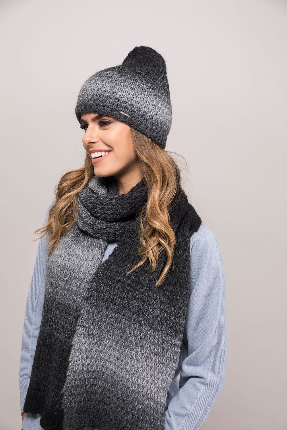 Stylish Kamea black graphite women's winter hat made with premium alpaca wool, showcasing thick stitches and bold tonal transitions for ultimate warmth and elegance.