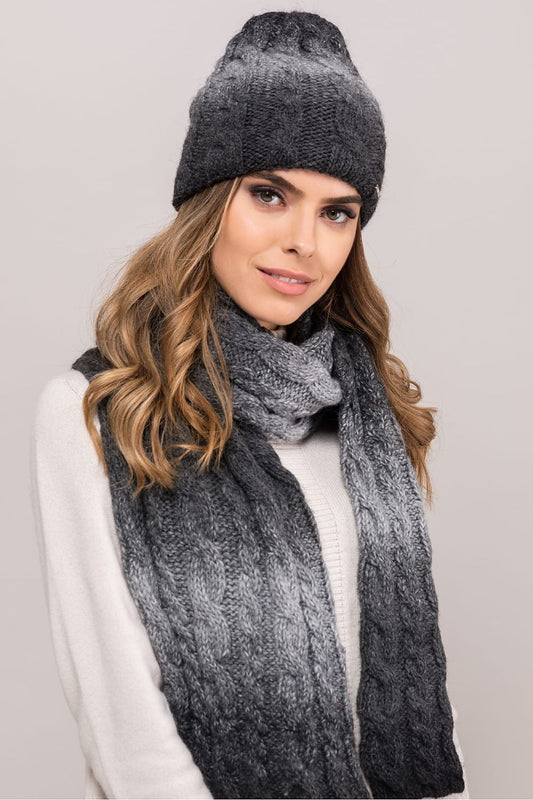 Close-up view of Kamea's black beanie hat showcasing the soft alpaca wool interior and elegant braided stitch details, ideal for chic winter outfits.