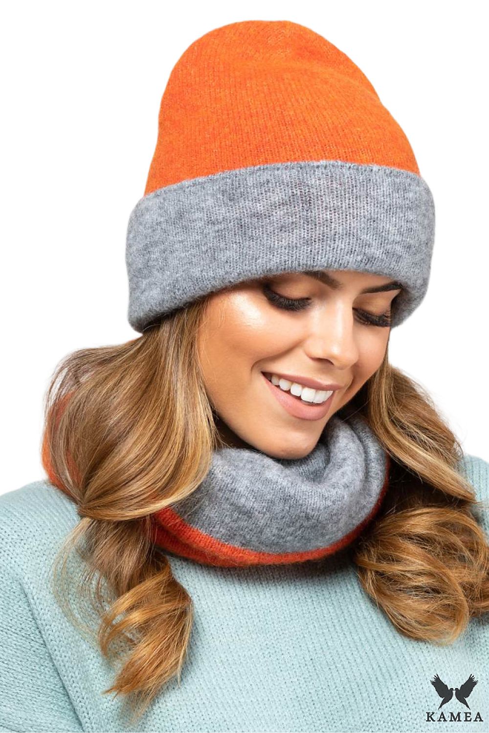 Luxurious double-sided women's hat by Kamea in brown-grey, designed for comfort and warmth, showcasing versatile styling options.