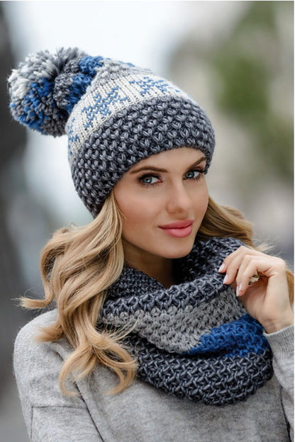 Luxurious Kamea women's fuchsia hat showcasing intricate thick stitches and vibrant colours, perfect for adding a chic touch to winter outfits.