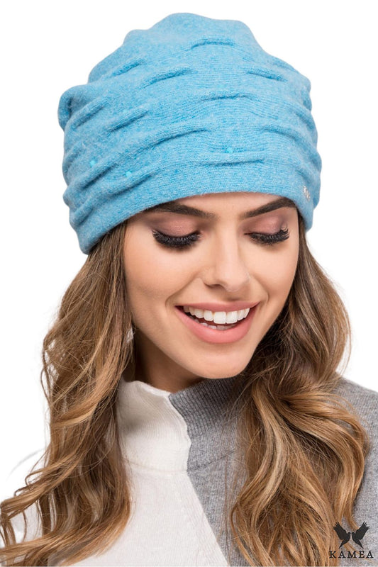 Premium Kamea women's turquoise melange hat featuring a unique coral pattern, ideal for creating stylish winter looks and providing warmth.