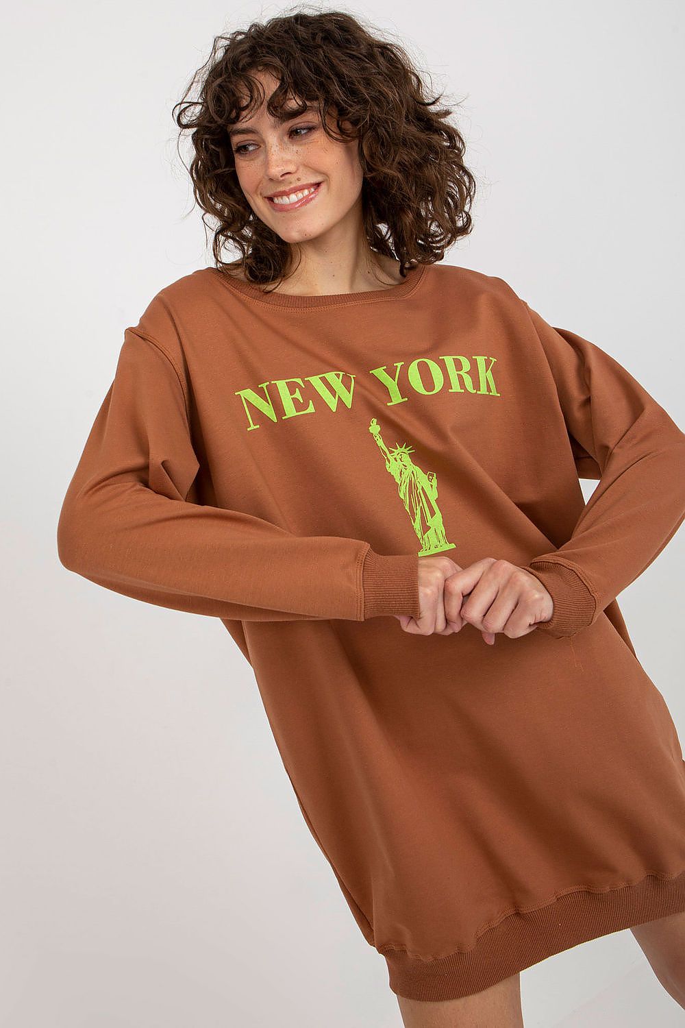 Model wearing the Factory Price women's oversized casual sweatshirt styled with leggings, ideal for a chic and casual outfit.