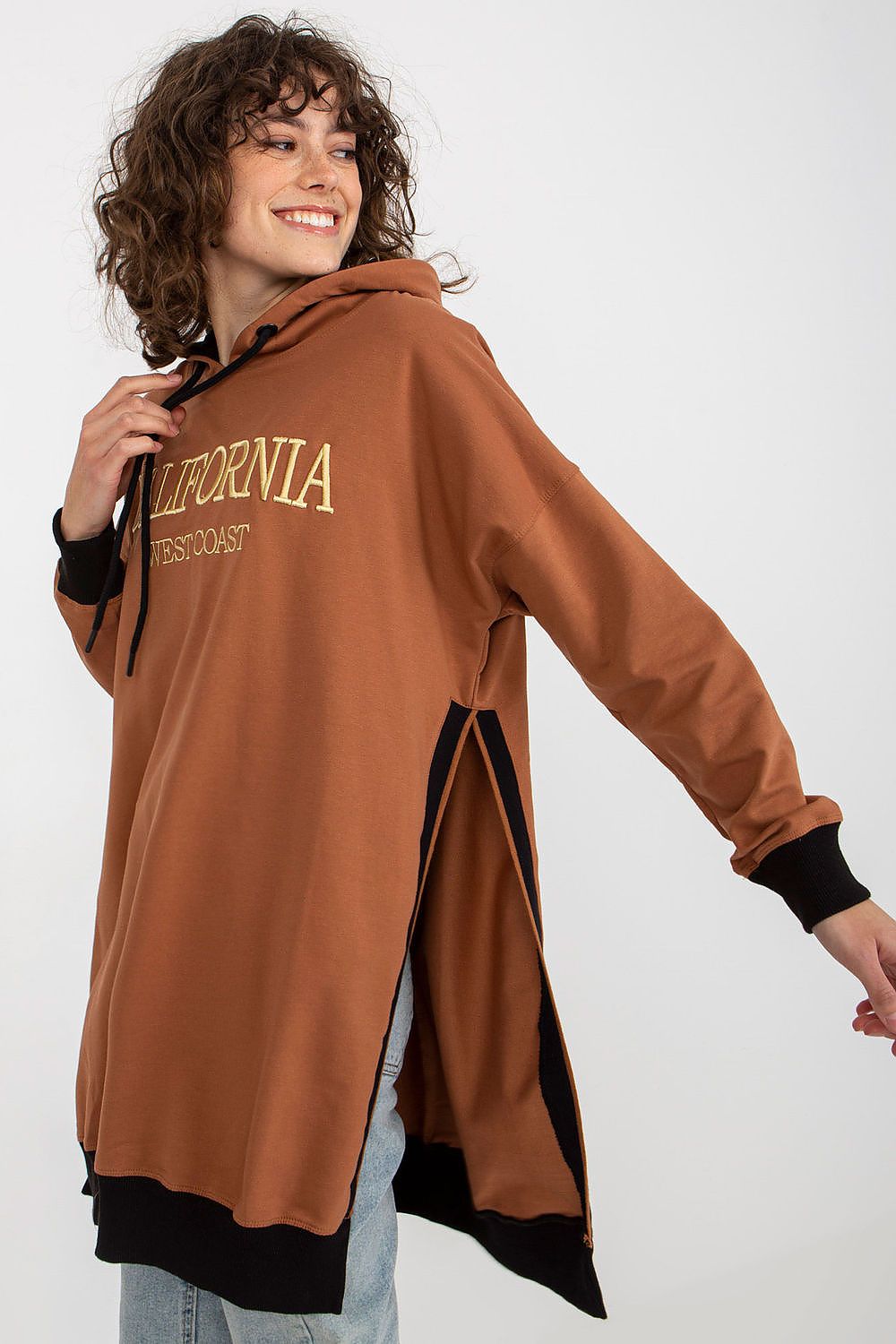 Chic women's long sweatshirt by Factory Price, highlighting its breathable cotton blend fabric and contemporary cut with side slits for a lightweight feel.